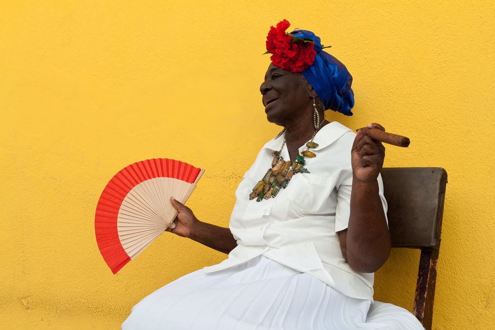 Cuban woman with a Cuban cigar in her hands