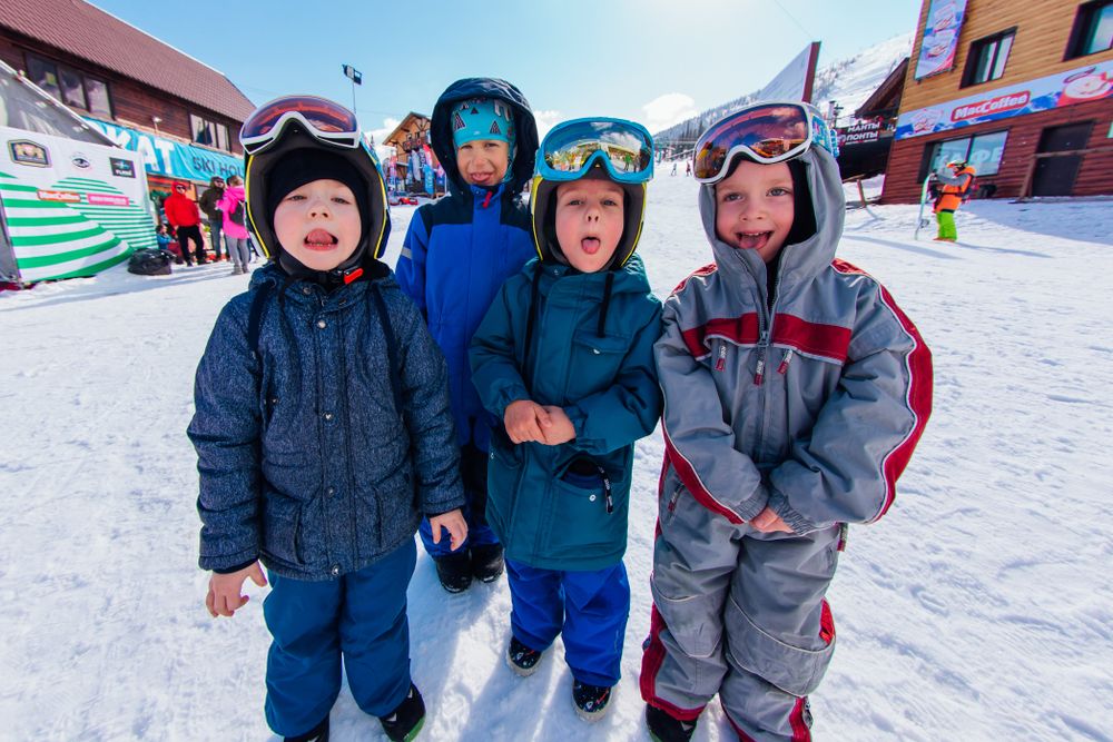 Cheerful children in winter in Sheregesh